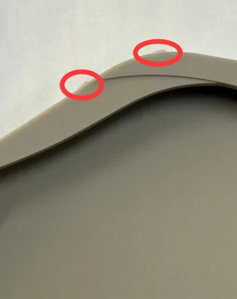 Custom silicone sleeve quality inspection revealing microscopic flash defects